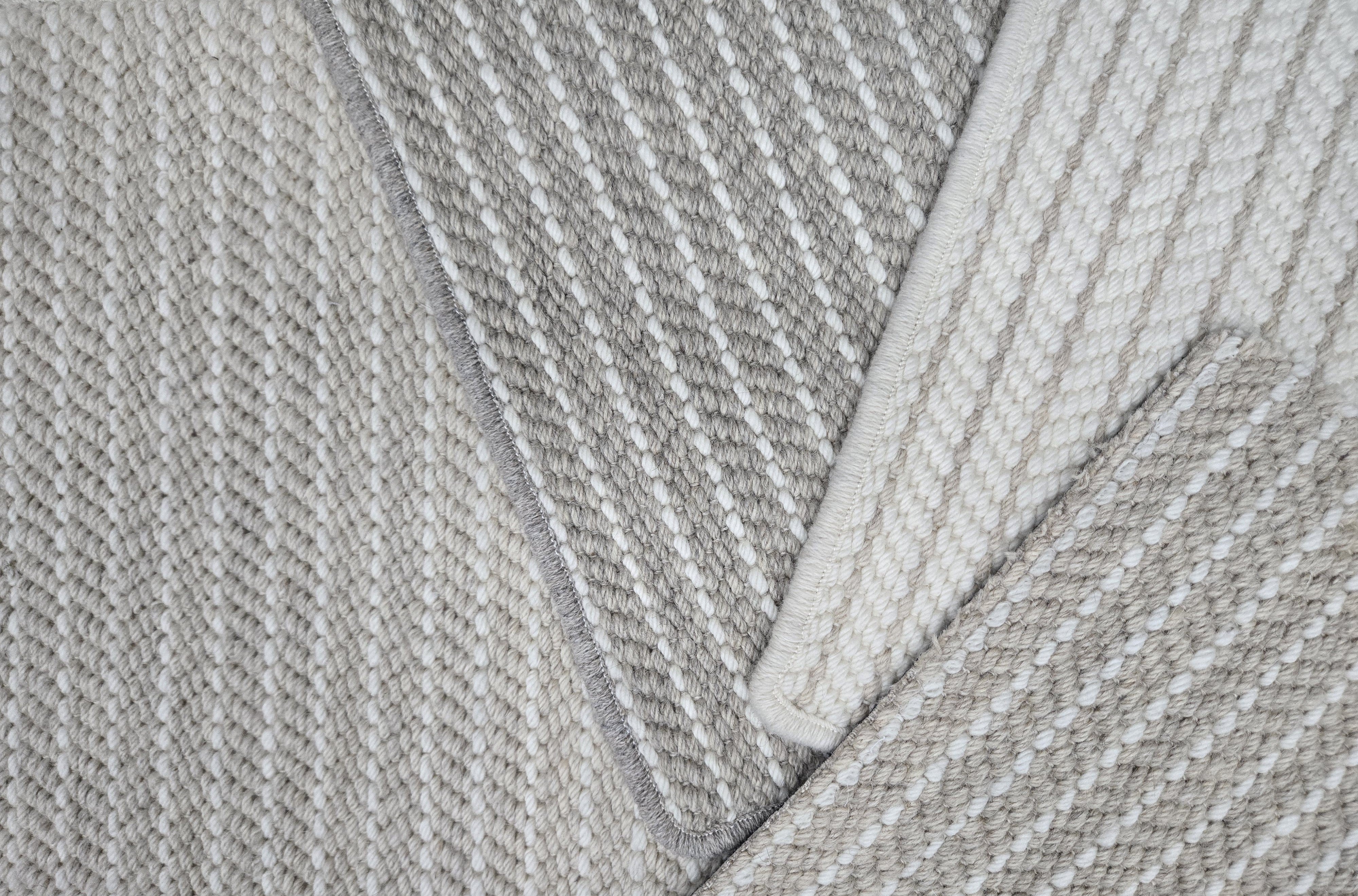 Broadloom carpet samples with stripe pattern in neutral colors 