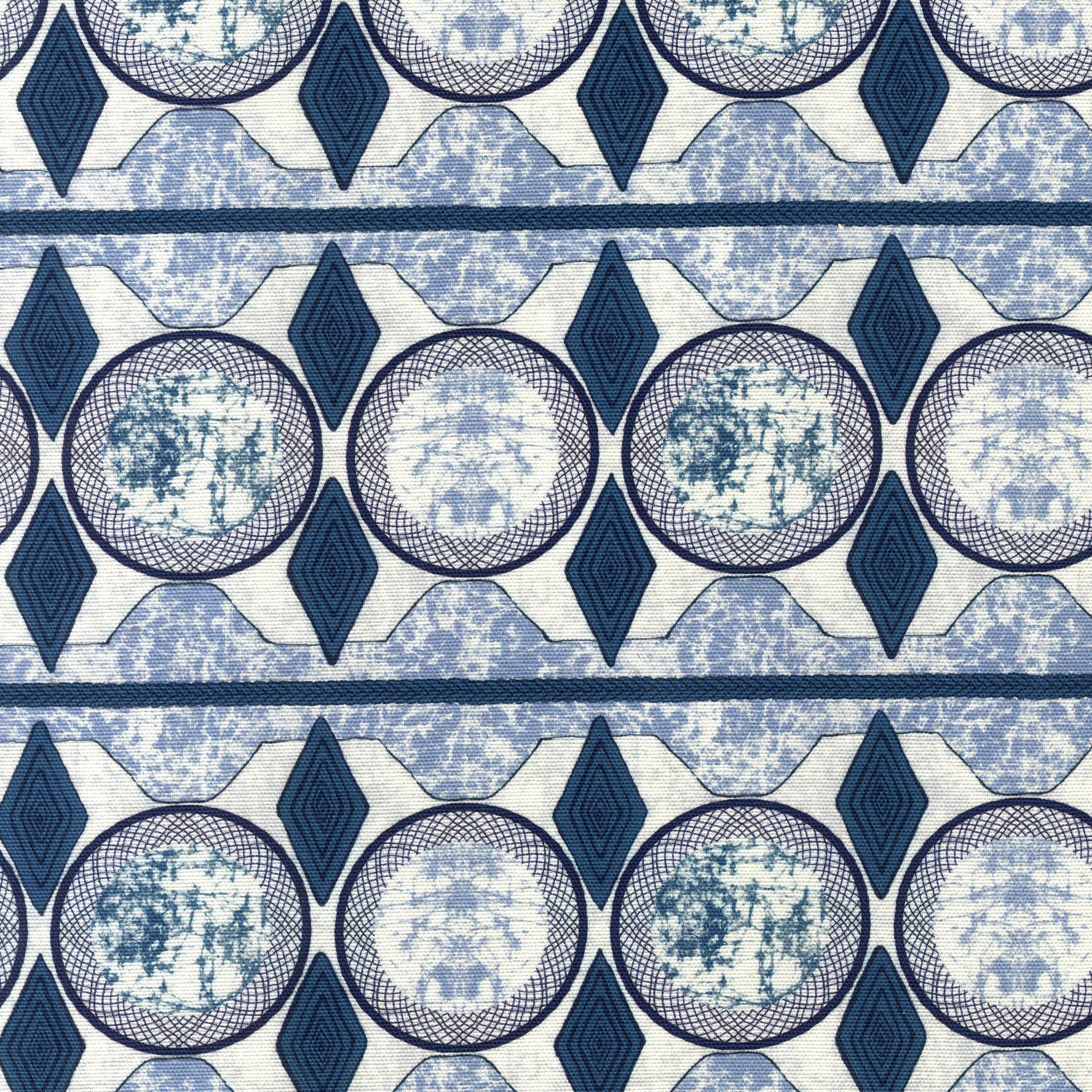 Detail of fabric in an intricate geometric stripe in shades of blue, navy and cream.