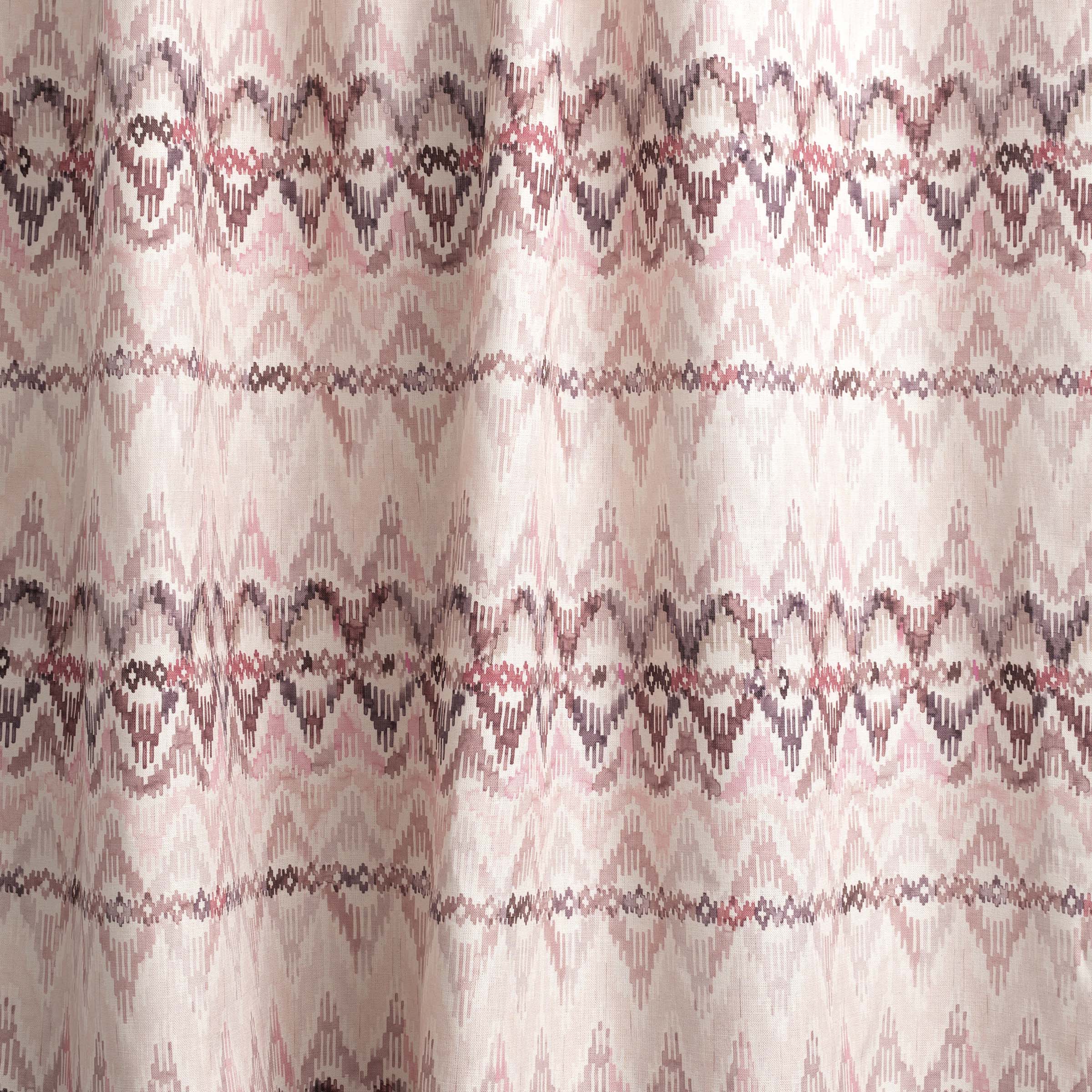 Draped fabric yardage in a painterly ikat print in shades of purple and pink on a white field.