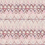 Detail of fabric in a painterly ikat print in shades of purple and pink on a white field.