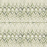 Detail of fabric in a painterly ikat print in shades of green on a white field.