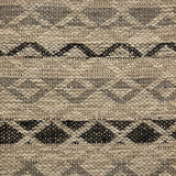 Handwoven rug detail in a lattice stripe design in black and grey