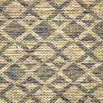 Handwoven rug detail in a lattice stripe design in blue, green, beige