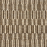 Handwoven rug detail in a geometric   design in tan and beige