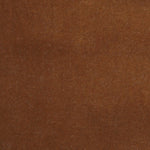 Detail of velvet fabric yardage in rust.