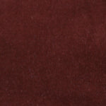 Detail of velvet fabric yardage in maroon.