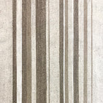 Detail of wallpaper in an irregular stripe print in shades of brown and cream.