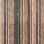 Detail of wallpaper in an irregular stripe print in shades of brown, pink, navy and turquoise.