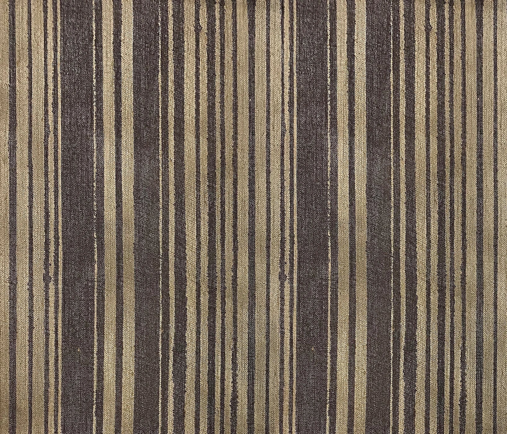 Detail of wallpaper in an irregular stripe print in shades of gold and brown.