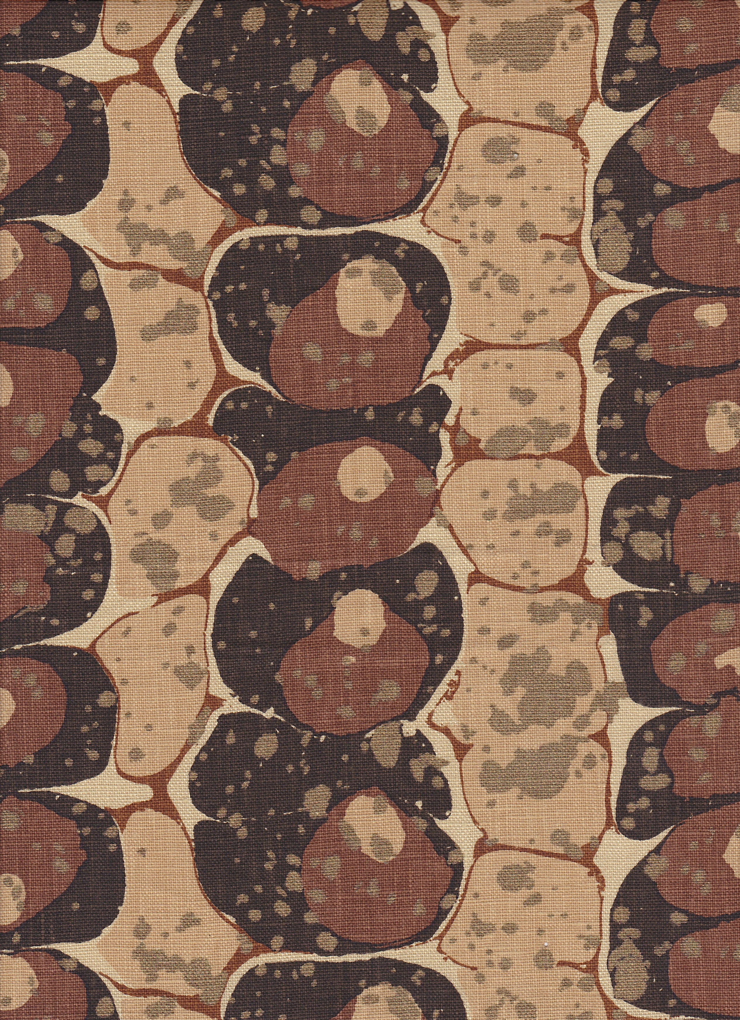 Detail of fabric in a marbled paint print in shades of brown, tan and black.