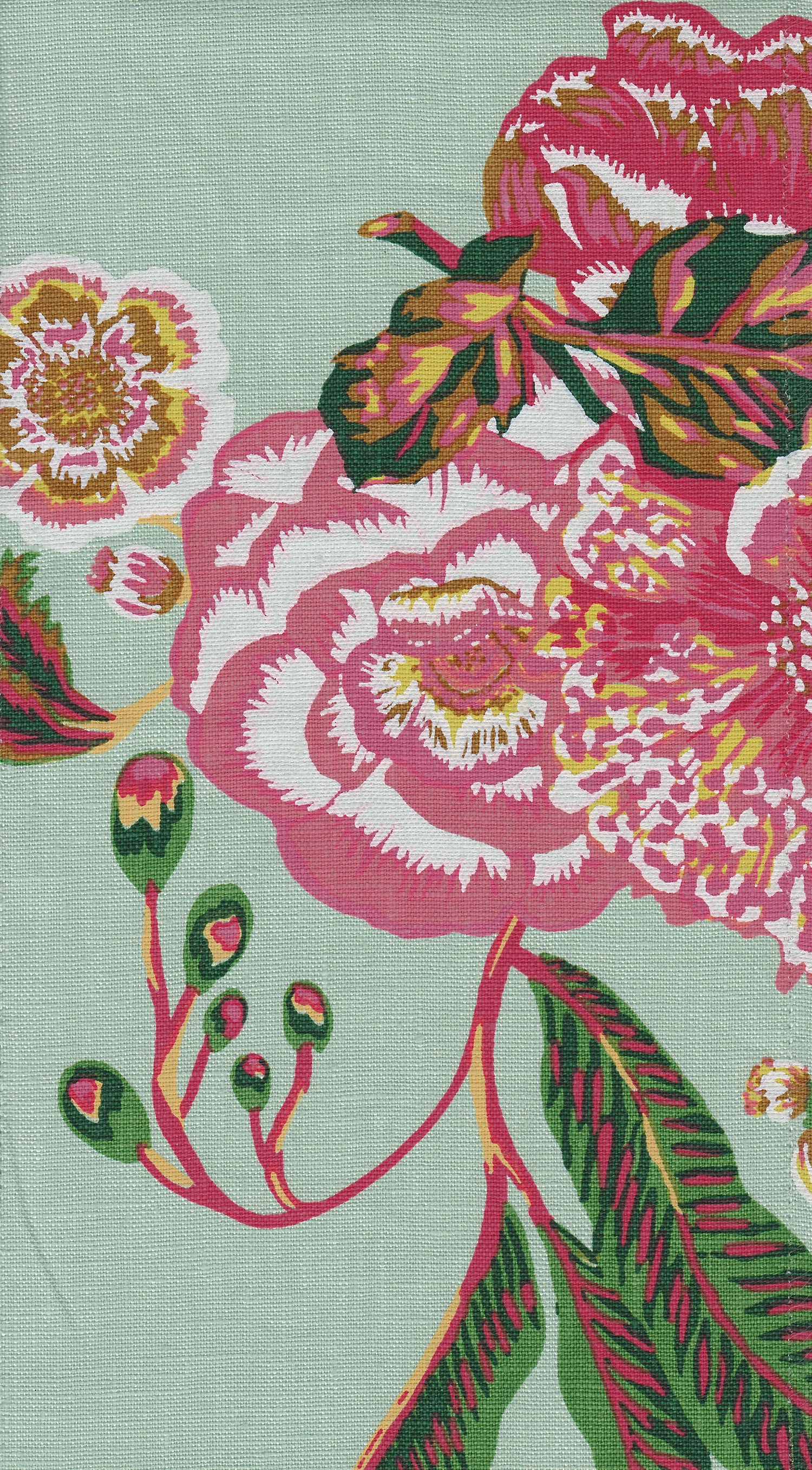 Detail of fabric in a floral print in shades of red, pink and green on a turquoise field.