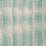 Detail of fabric in a dense repeating stripe and star print in turquoise on a tan field.