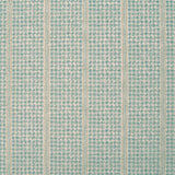 Detail of fabric in a dense repeating stripe and star print in turquoise on a tan field.