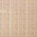 Detail of fabric in a dense repeating stripe and star print in burnt orange on a cream field.