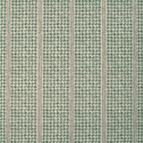 Detail of fabric in a dense repeating stripe and star print in green on a tan field.