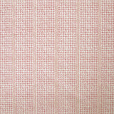 Detail of fabric in a dense repeating stripe and star print in pink on a cream field.