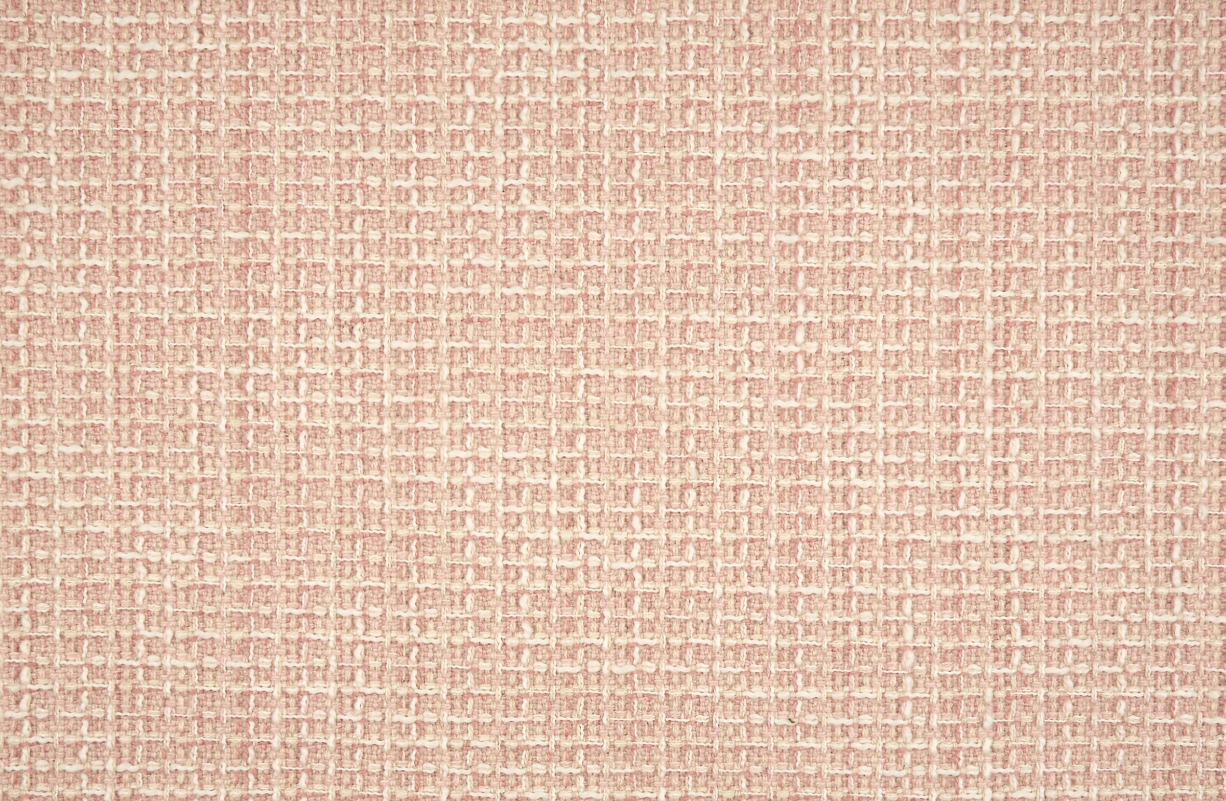 Broadloom carpet in a textural weave in pastel pink