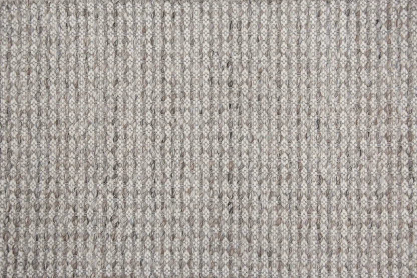 Broadloom carpet swatch in a textured pattern in a grey white design