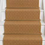 Striped flatweave runner design in tan and red on white staircase