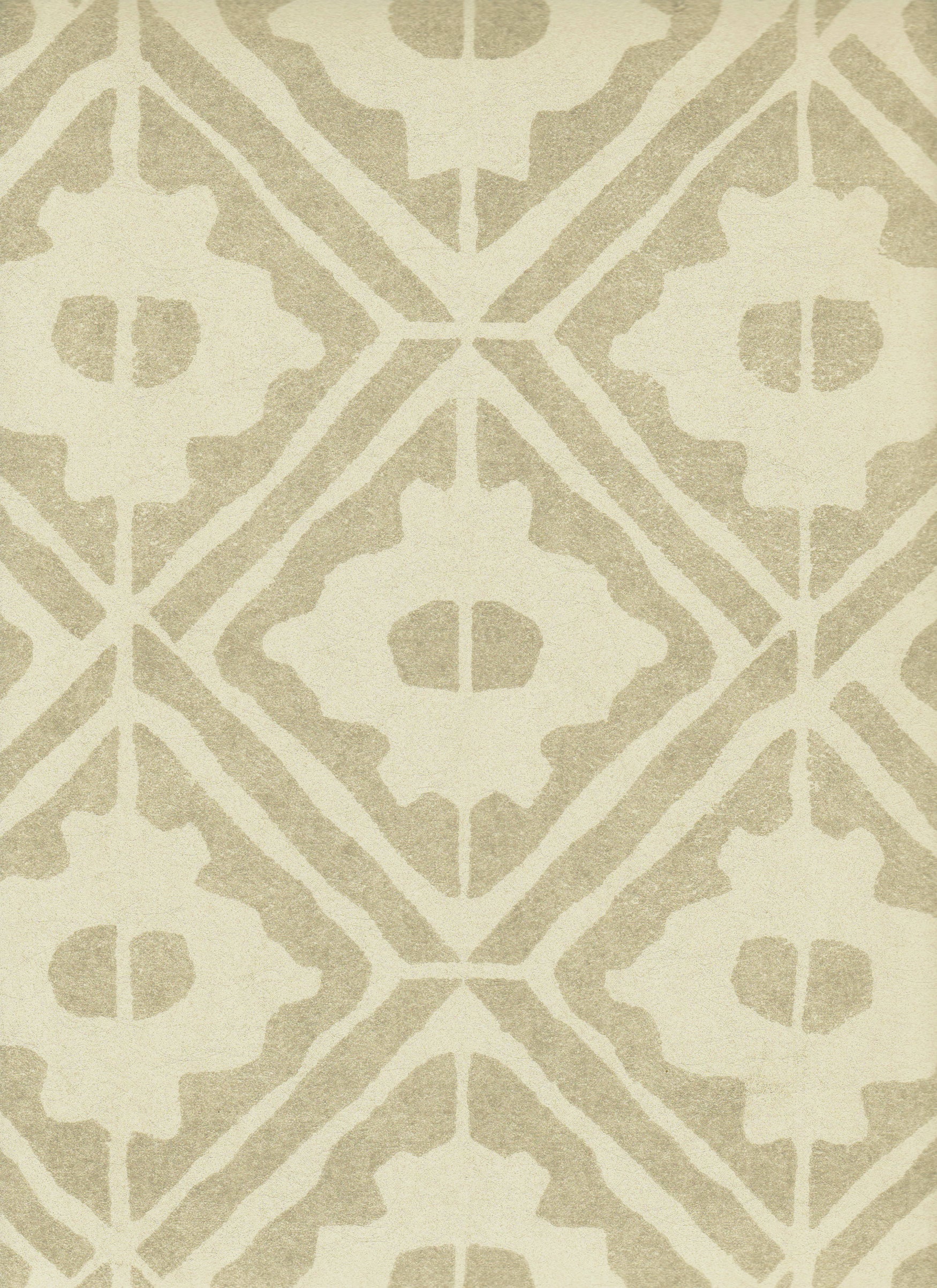 Detail of wallpaper in a geometric lattice print in tan on a cream field.