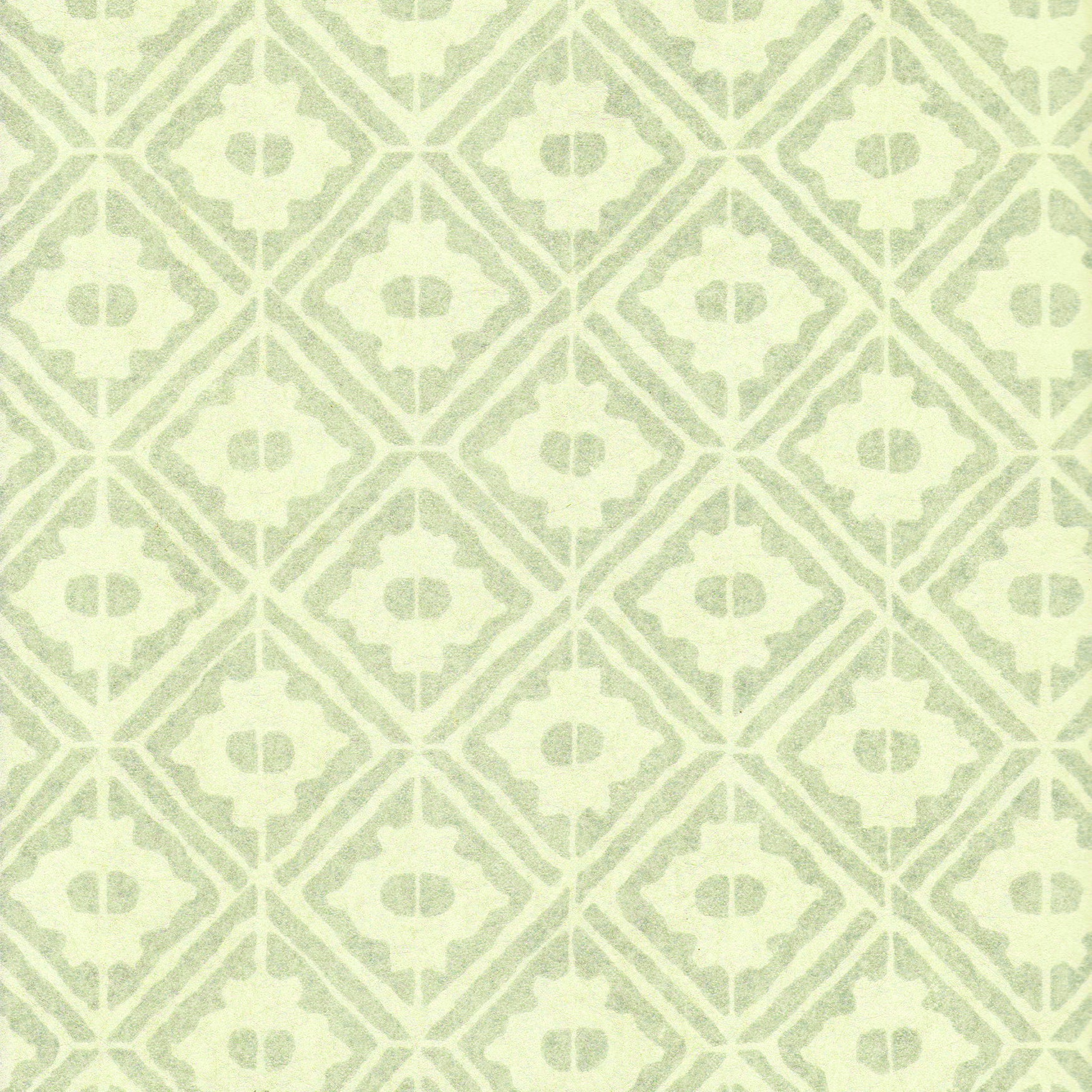 Detail of wallpaper in a geometric lattice print in shades of green.