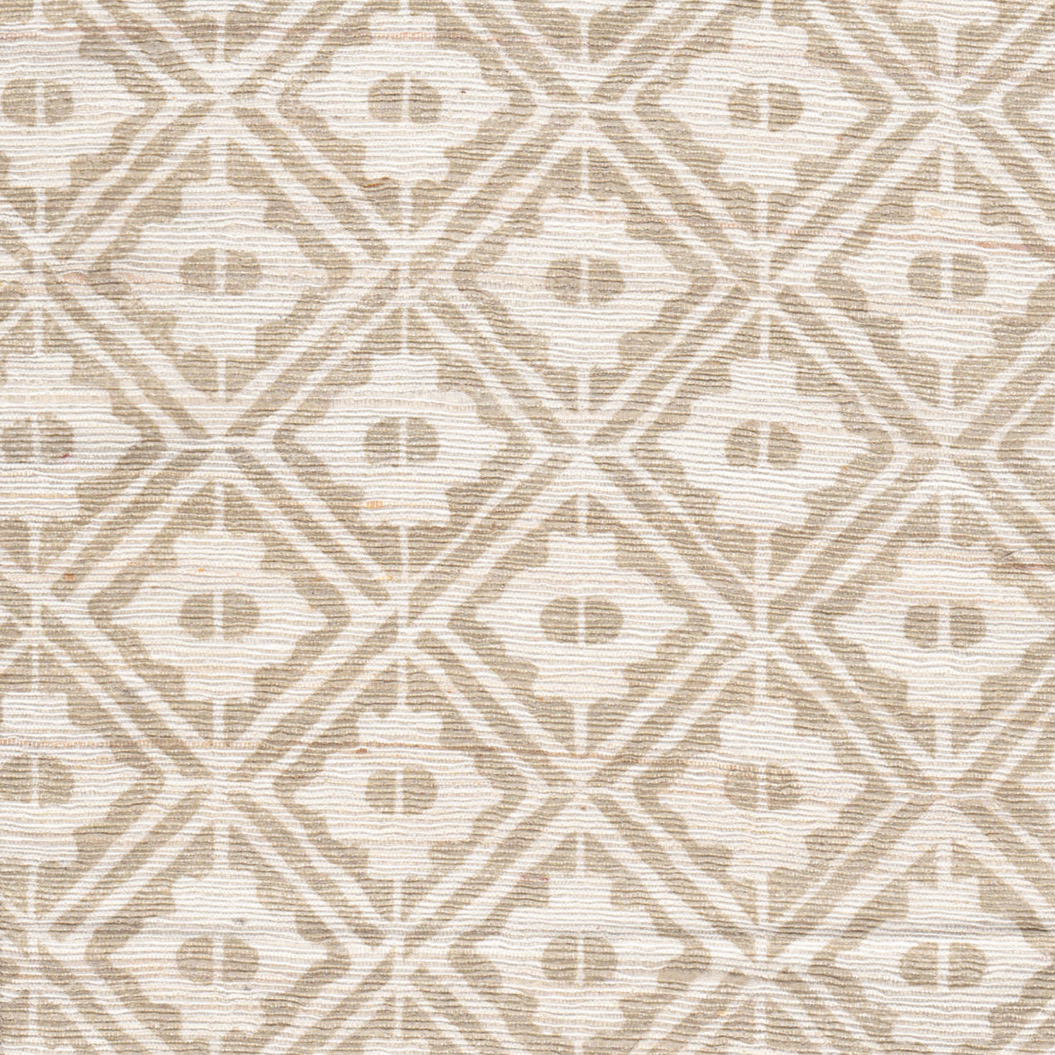 Detail of fabric in a geometric lattice grid in tan on a cream field.