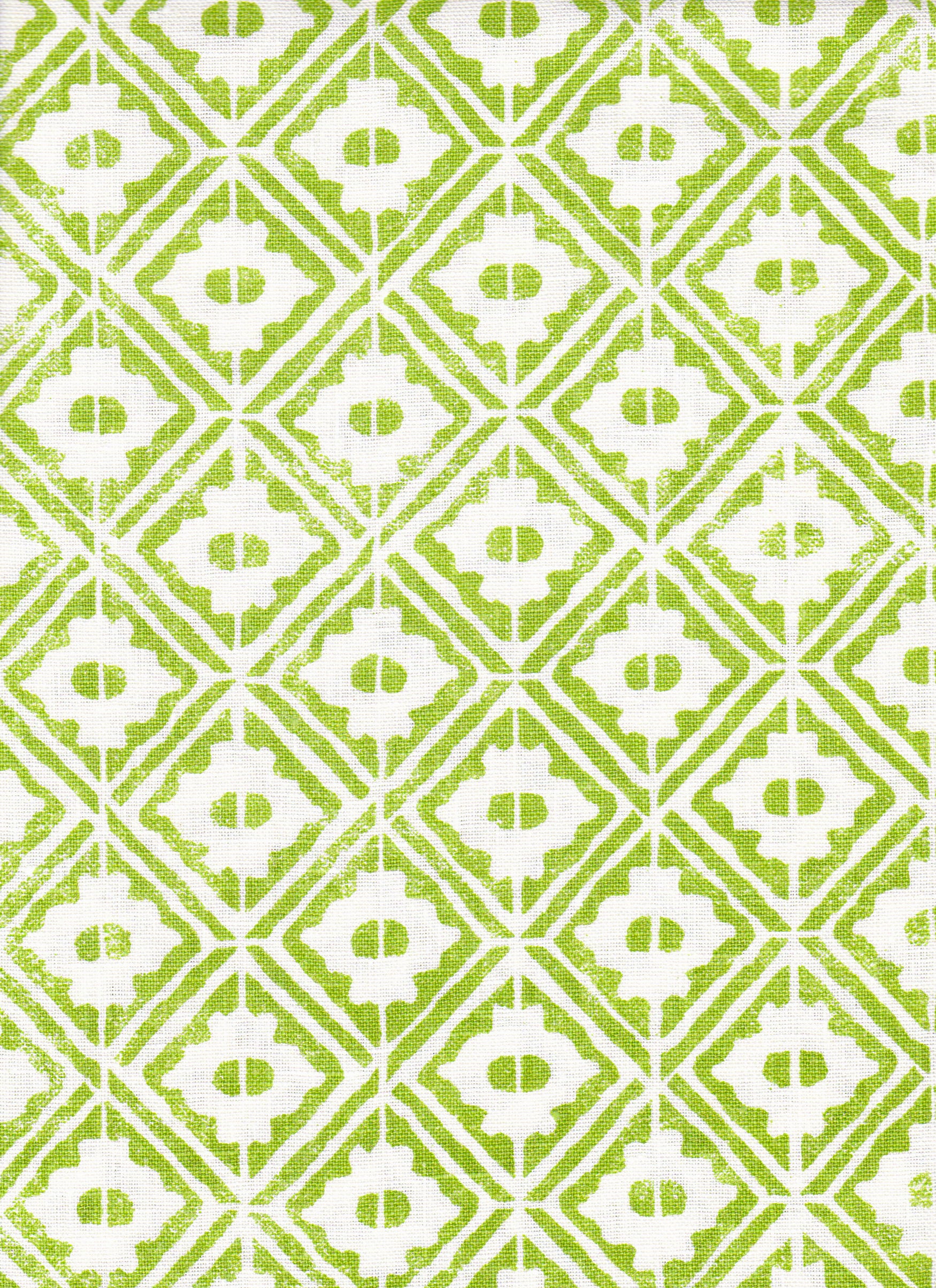 Detail of fabric in a geometric lattice grid in green on a white field.