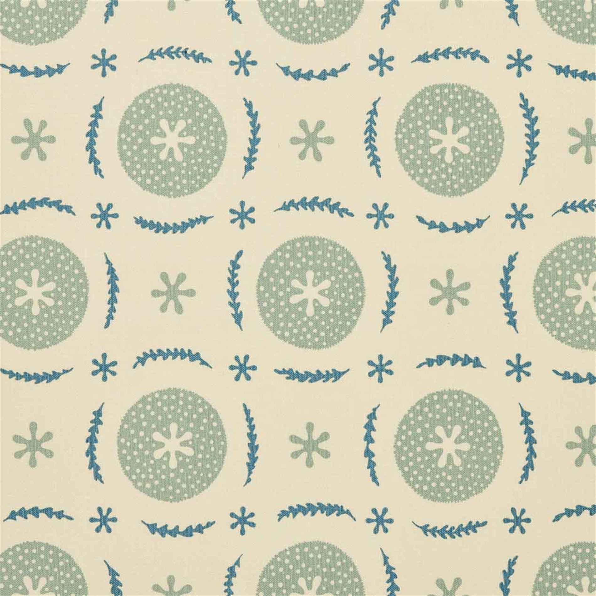 Detail of fabric in a repeating berry and leaf pattern in blue and turquoise on a tan field.