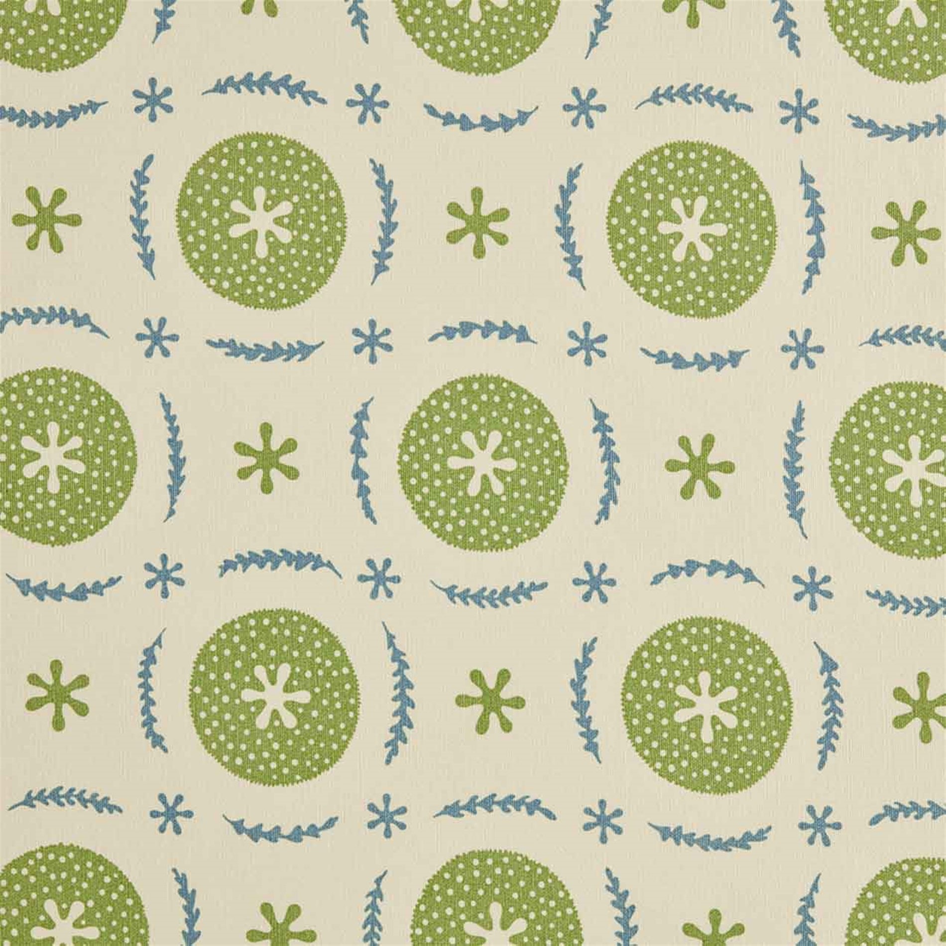 Detail of fabric in a repeating berry and leaf pattern in blue and green on a tan field.