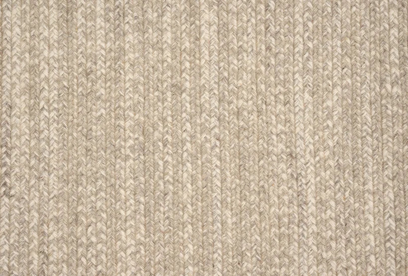 Broadloom carpet swatch in a textured pattern in a tan design