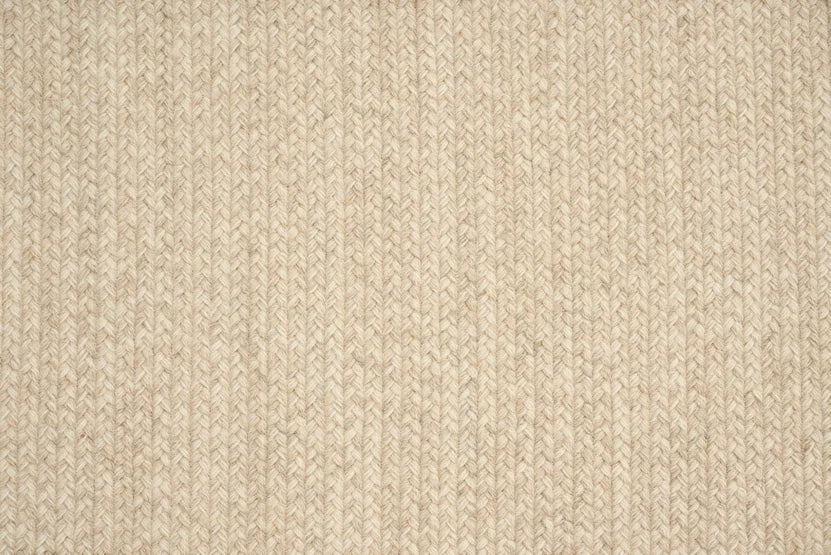 Broadloom carpet swatch in a textured pattern in a neutral tan design