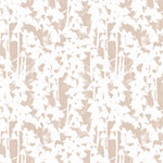 Detail of fabric in a painterly bluebell pattern in white on a mottled blush field.