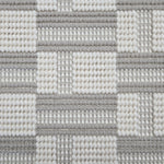 Broadloom carpet in a complex checkerboard pattern in ivory and light grey.