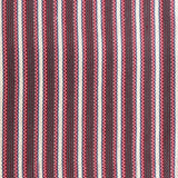 Detail of a hand-woven cotton fabric in an intricate stripe pattern in shades of pink, red, white and blue.