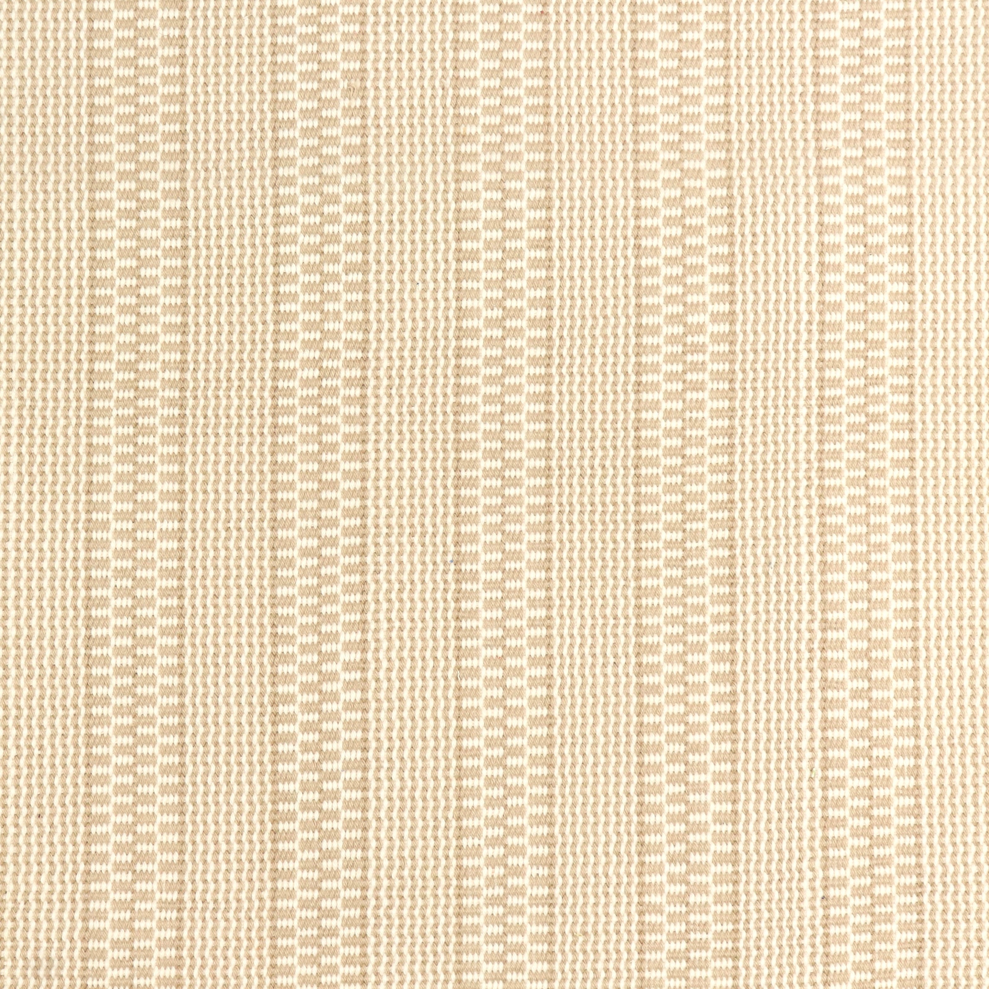 Detail of a hand-woven cotton fabric in a striped twill pattern in cream and white.
