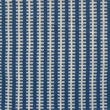 Detail of a hand-woven cotton fabric in an intricate gridded stripe pattern in shades of cream, blue and navy.