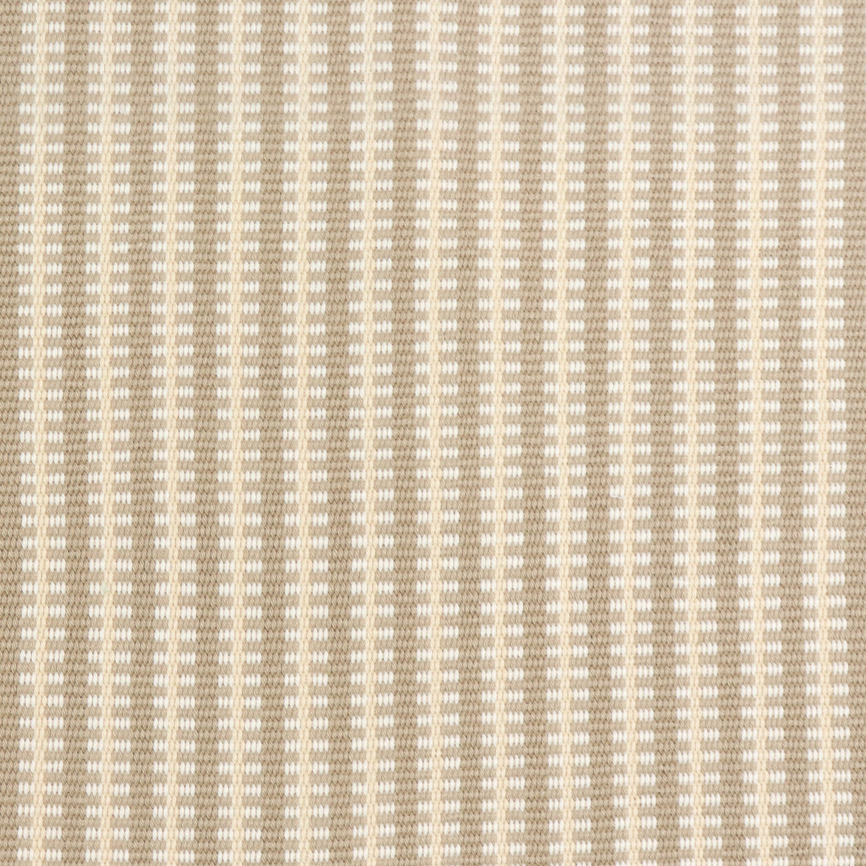 Detail of a hand-woven cotton fabric in an intricate gridded stripe pattern in shades of cream, tan and white.