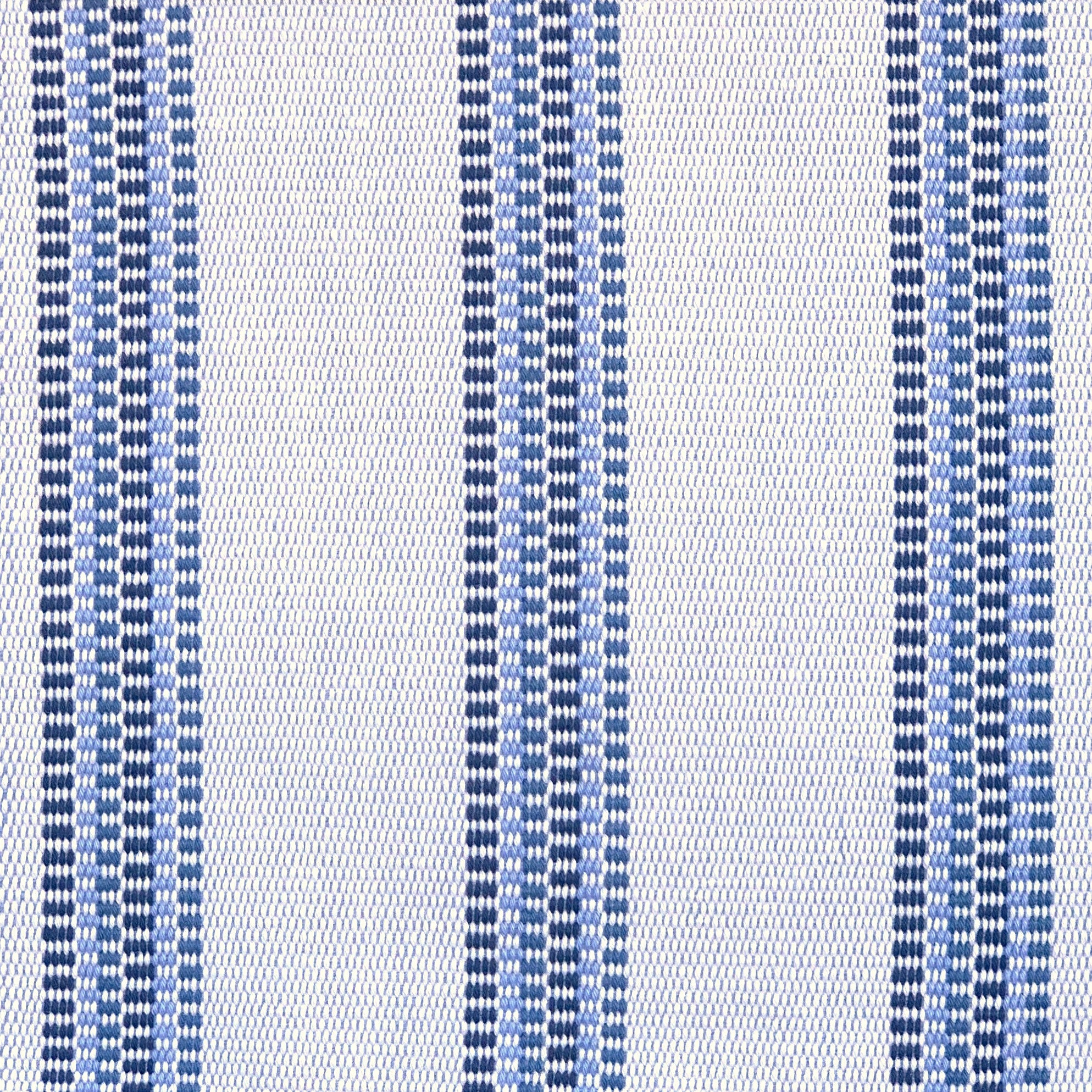 Detail of a hand-woven cotton fabric in an irregular stripe pattern in navy and blue on a white field.