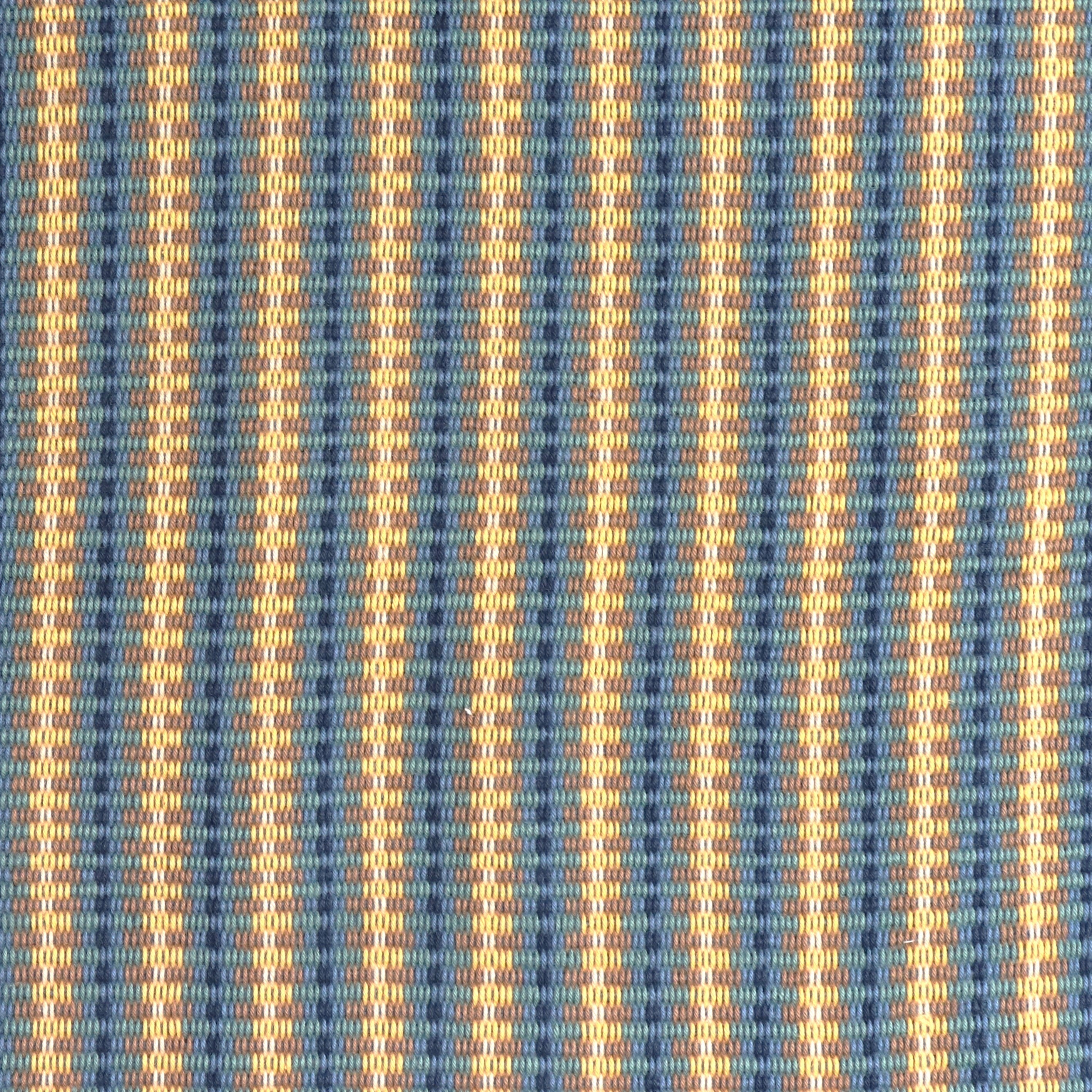 Detail of a hand-woven cotton fabric in an intricate stripe pattern in shades of blue, navy, tan and yellow.