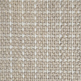 Close-up of a carpet with a textured check pattern in beige and cream. 