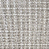 Close-up of a carpet with a textured check pattern in grey and white.
