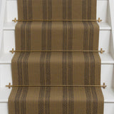 Striped brown flatweave runner in tan on white stairs