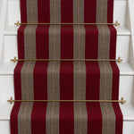 Striped brown flatweave runner in red on white stairs