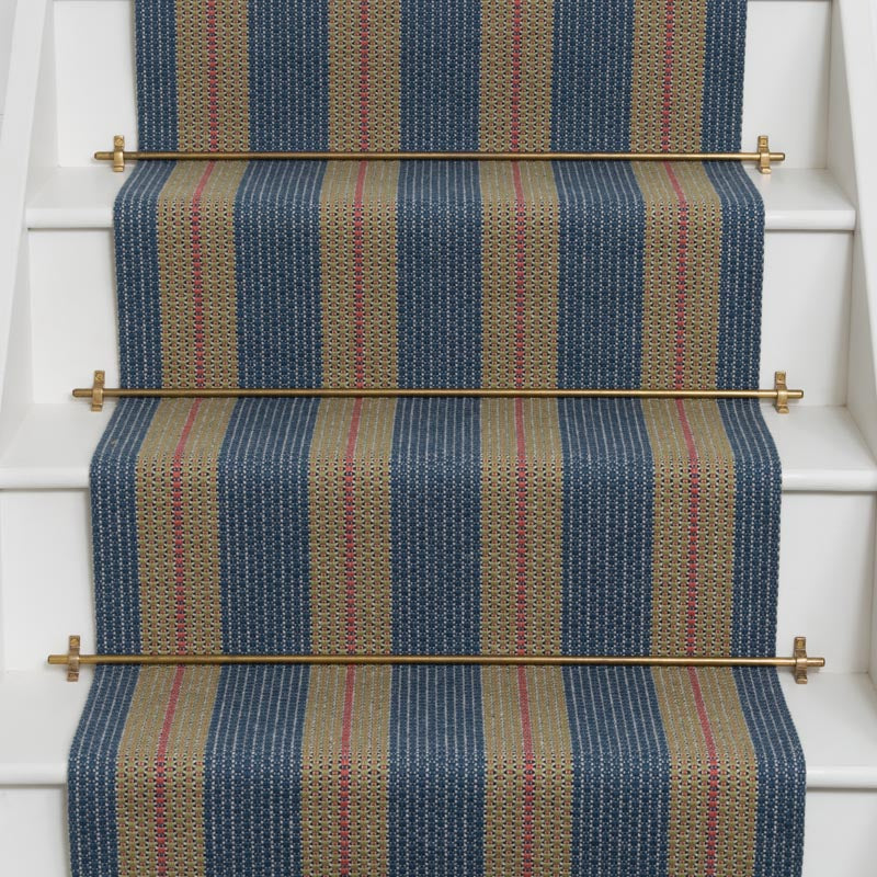 Striped brown flatweave runner in blue and tan with red on white stairs