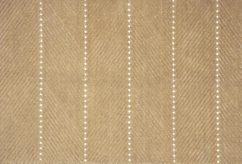 Broadloom carpet swatch in a textured pattern in a tan design