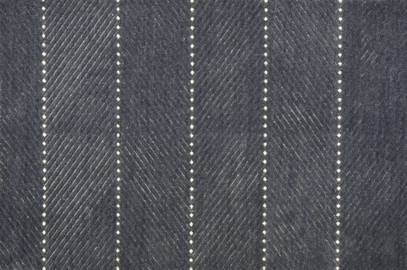 Broadloom carpet swatch in a textured pattern in a dark grey blue design