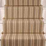 Striped flatweave runner in cream on white stairs