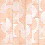 Detail of leather wall tiles in a repeating curvolinear pattern in pink and cream.