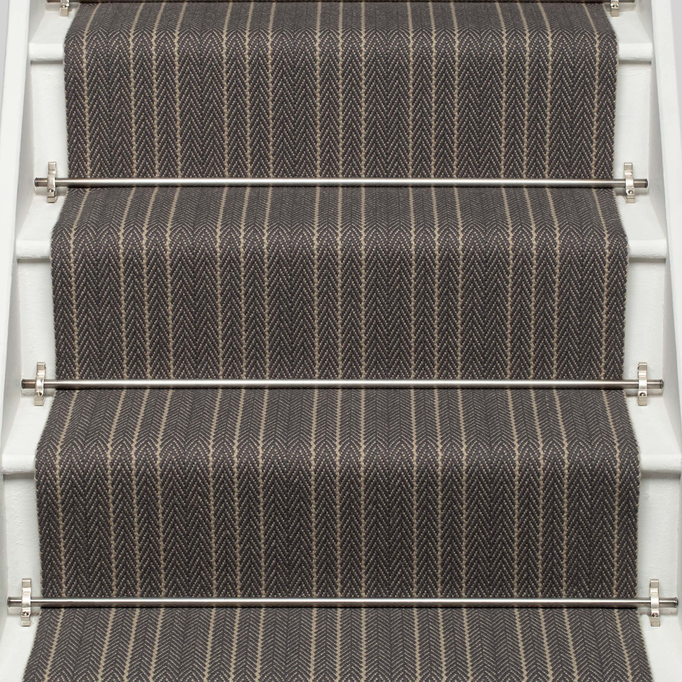 Striped flatweave runner in black and ivory on white staircase