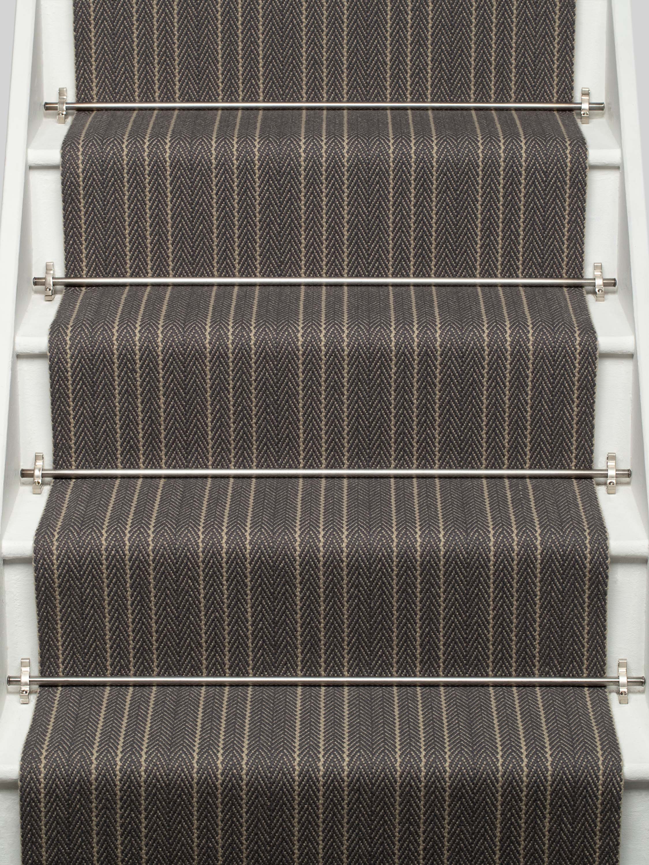 Striped flatweave runner in black and ivory on white staircase